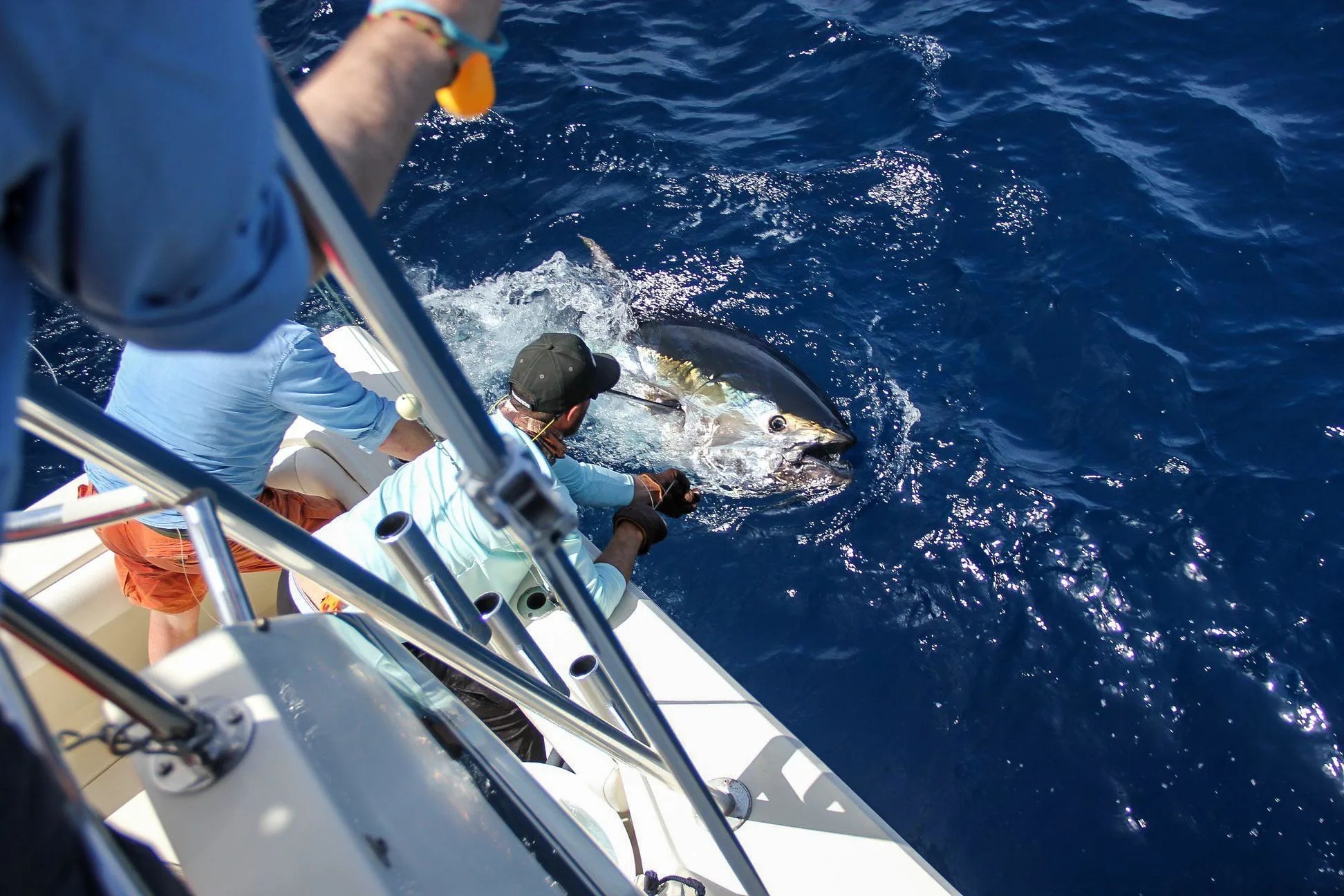Angler fighting a large game fish during a Watamu deep sea fishing charter